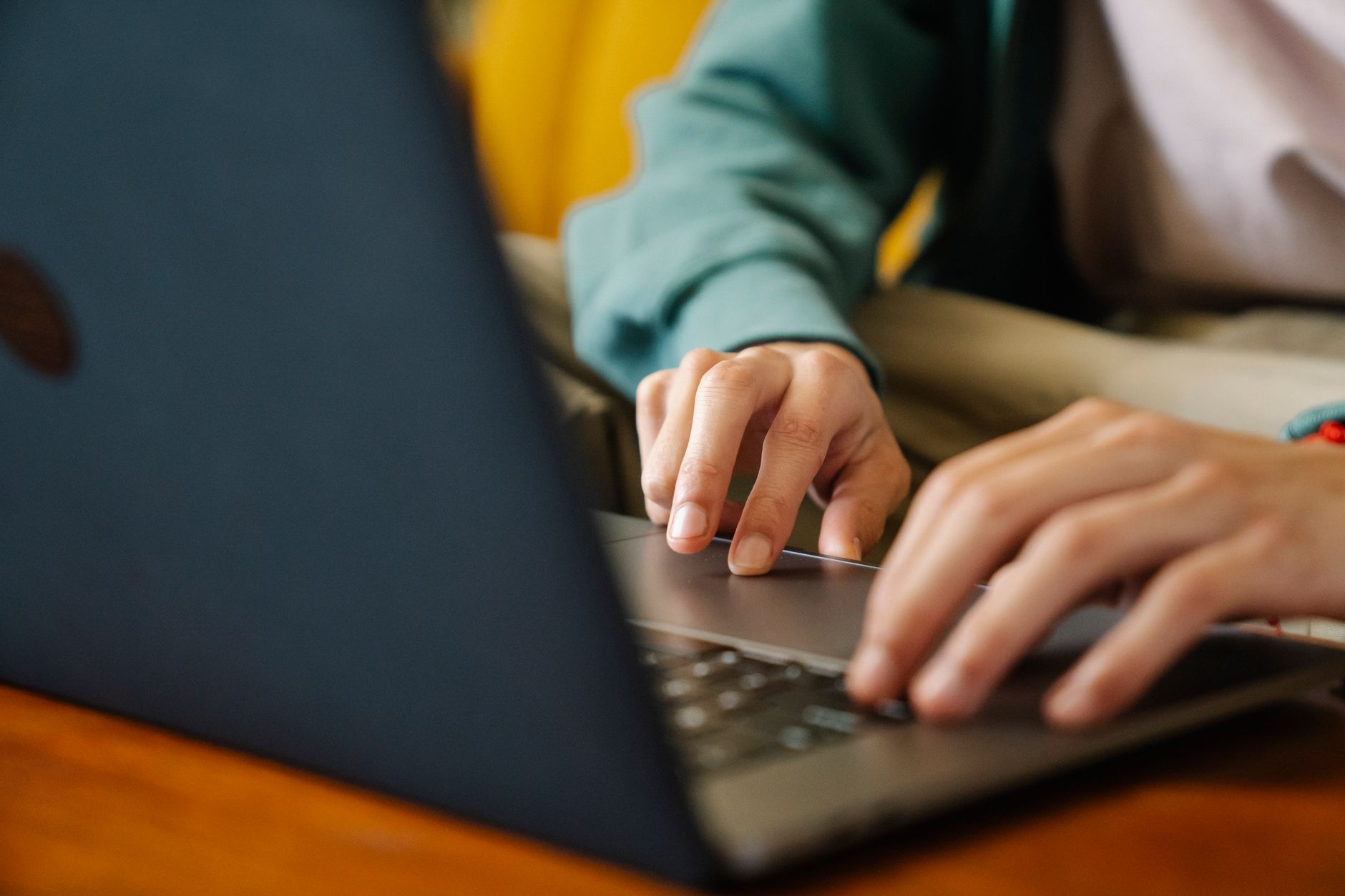 a person filling out an online complaint form on a laptop with a government website on screen