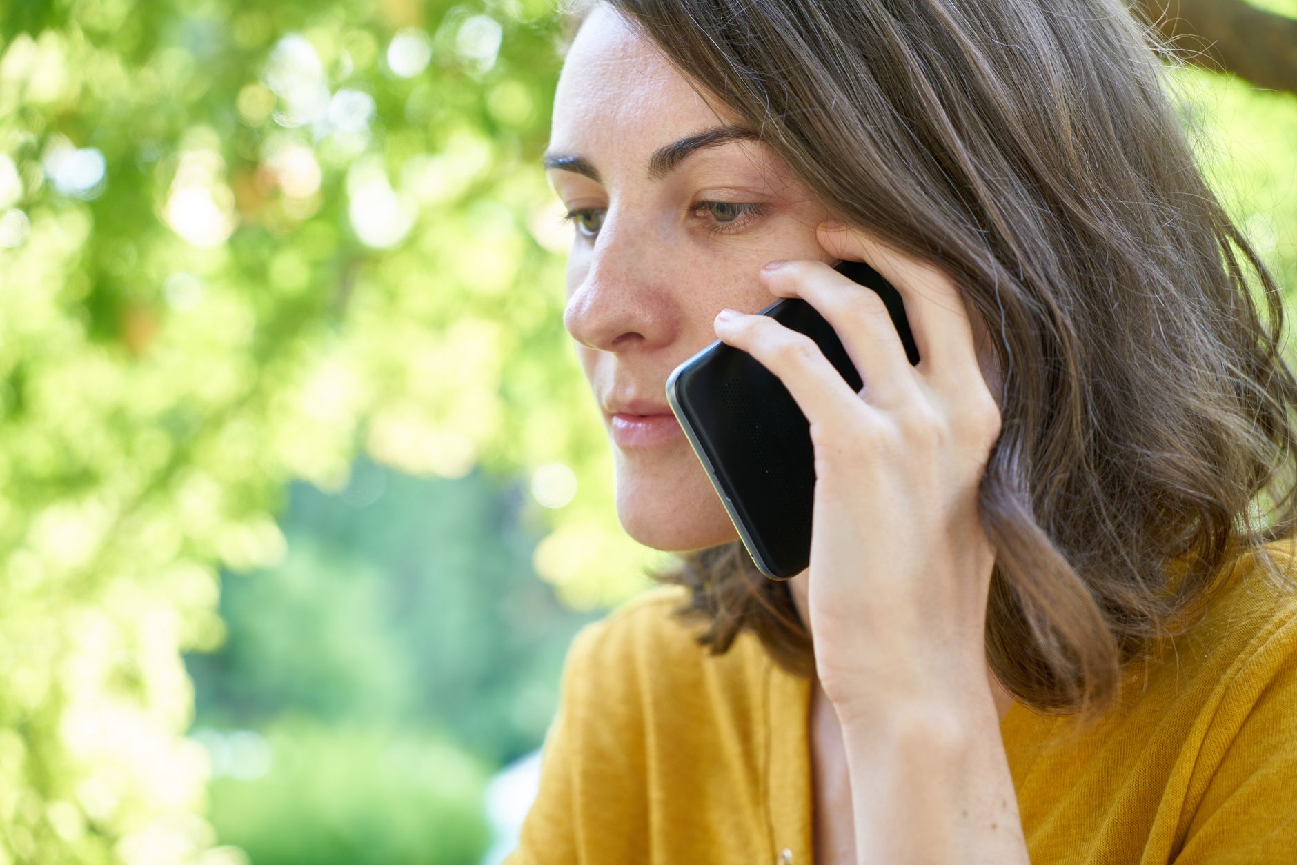 A person pressing the end call button on a smartphone after a suspicious call